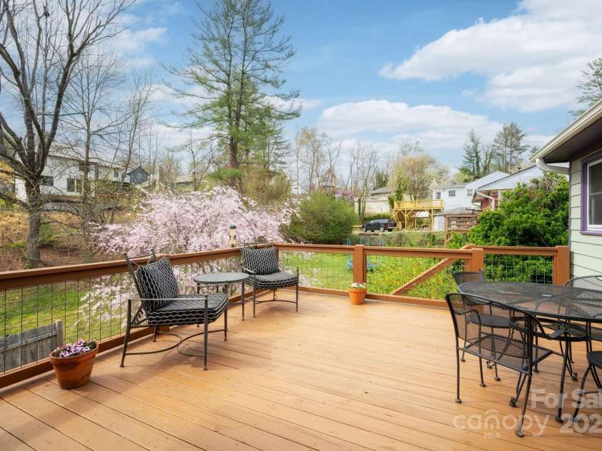 244 Bear Creek Road, Asheville, NC 28806.  MLS# CAR4243521, YatesRealty ID 7055. Large Deck w/ Stairs to Backyard