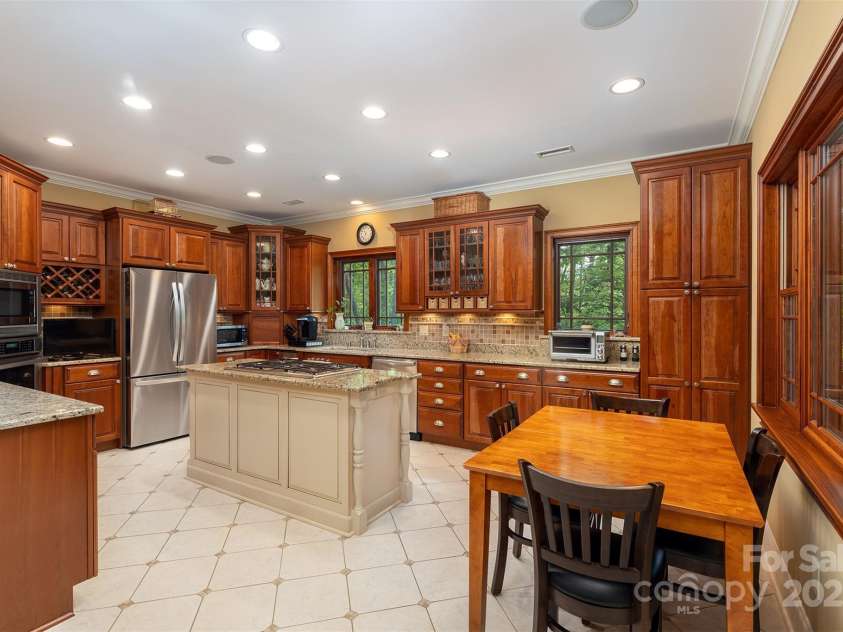 168 Chattooga Run, Hendersonville, NC 28739.  MLS# CAR4250934, YatesRealty ID 706. Beautiful kitchen with rich cherry custom cabinetry and timeless style