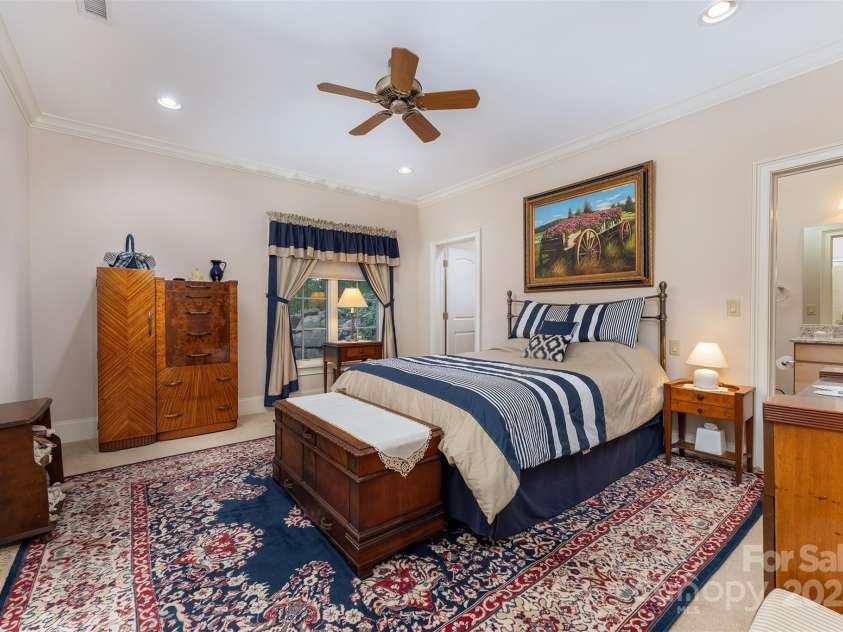 168 Chattooga Run, Hendersonville, NC 28739.  MLS# CAR4250934, YatesRealty ID 706. Comfortable guest bedroom featuring a private ensuite