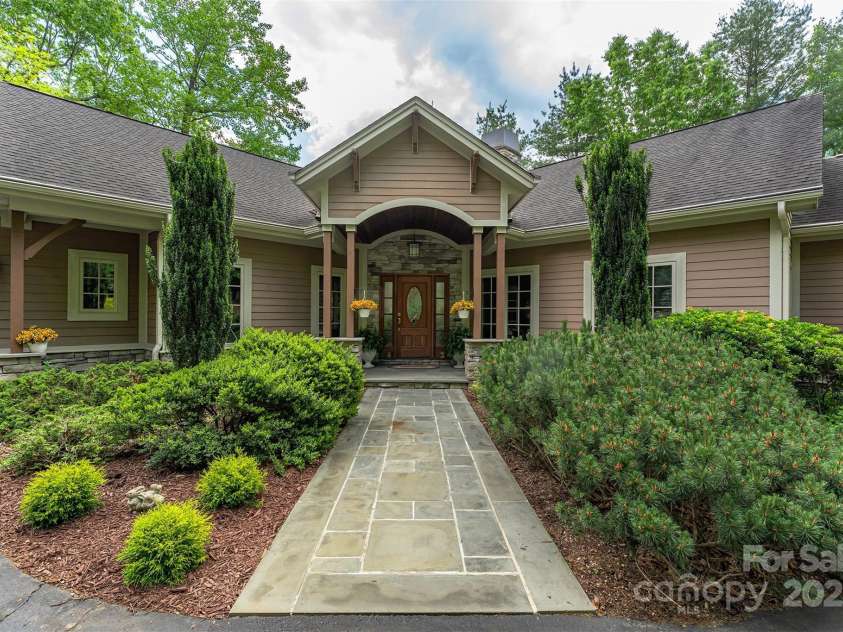 168 Chattooga Run, Hendersonville, NC 28739.  MLS# CAR4250934, YatesRealty ID 706. Effortless main-level access with welcoming curb appeal