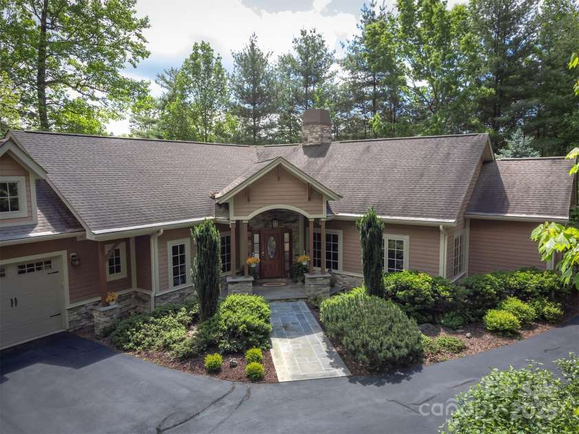 168 Chattooga Run, Hendersonville, NC 28739.  MLS# CAR4250934, YatesRealty ID 706. Gorgeous landscaping that enhances the home's charm.