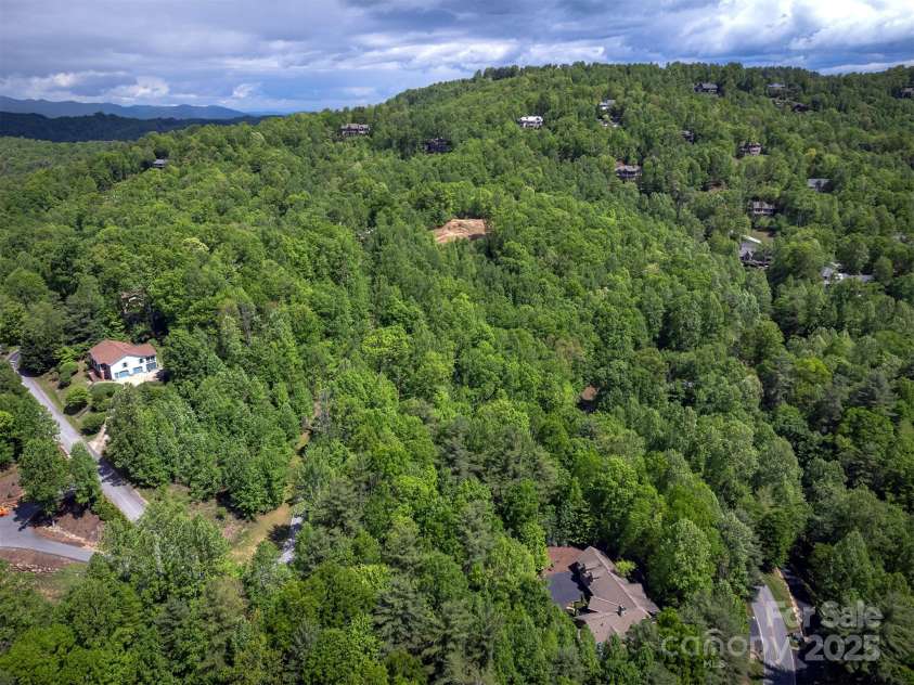 168 Chattooga Run, Hendersonville, NC 28739.  MLS# CAR4250934, YatesRealty ID 706. Situated in a spacious, low-density community in Champion Hills.