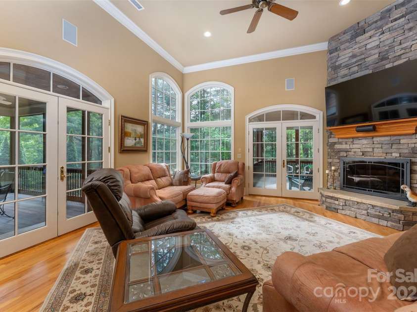 168 Chattooga Run, Hendersonville, NC 28739.  MLS# CAR4250934, YatesRealty ID 706. Spacious great room filled with natural light and highlighted by gorgeous wood floors