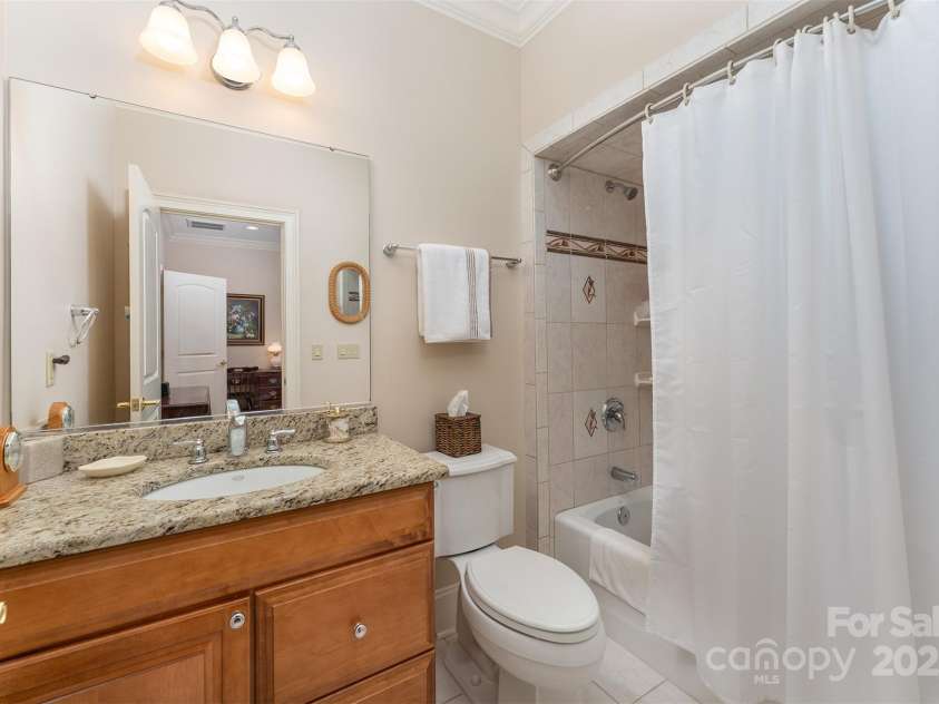 168 Chattooga Run, Hendersonville, NC 28739.  MLS# CAR4250934, YatesRealty ID 706. Stylish ensuite bath with tile and granite details