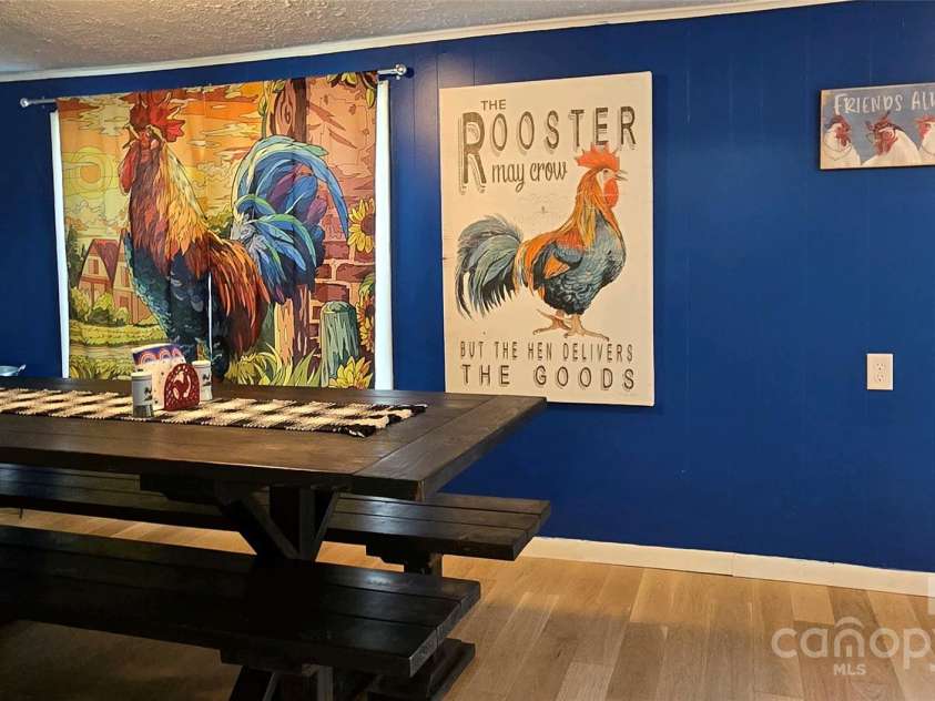 626 Fairview Loop, Hot Springs, NC 28743.  MLS# CAR4302454, YatesRealty ID 706. The dining room is the home of the roosters, and a few hens!