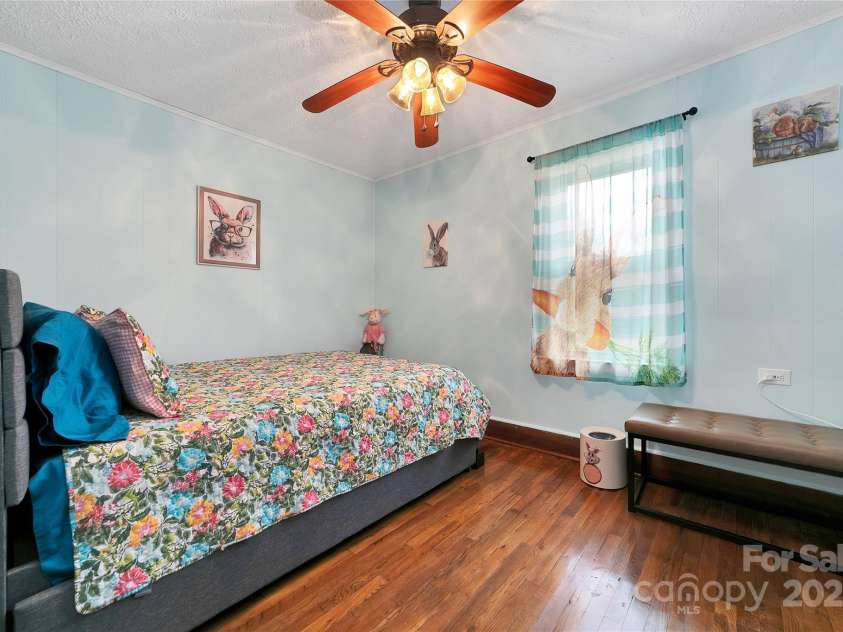 626 Fairview Loop, Hot Springs, NC 28743.  MLS# CAR4302454, YatesRealty ID 706. The middle bedroom is alive with bunny rabbits in every corner! Queen size with pull out trundle bed allows for three to sleep comfortably!