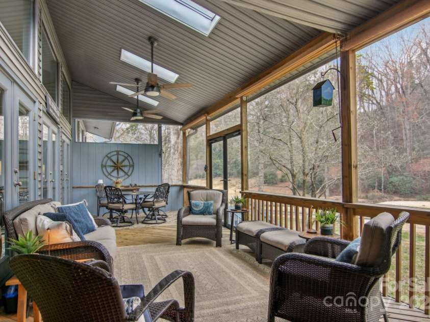 441 Mountains Boulevard, Lake Lure, NC 28746.  MLS# CAR4238819, YatesRealty ID 7068. Lanai looking towards stream