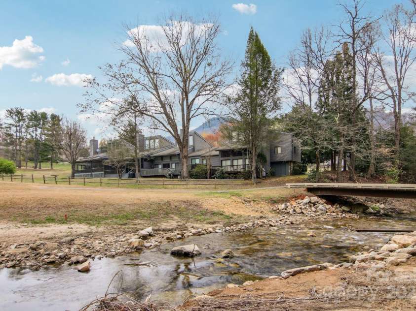 441 Mountains Boulevard, Lake Lure, NC 28746.  MLS# CAR4238819, YatesRealty ID 7068. Looking back toward unit from stream