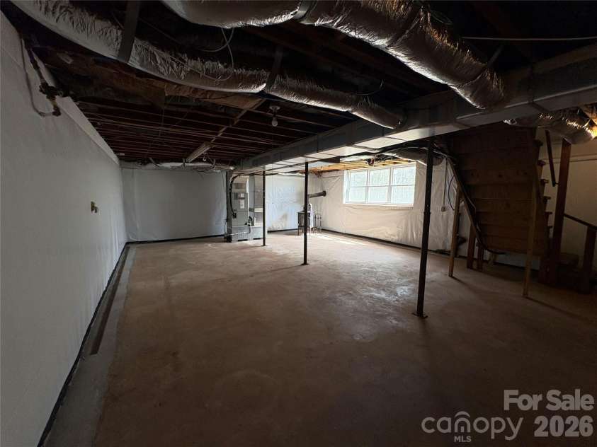 2137 23rd Street Drive, Hickory, NC 28602.  MLS# CAR4356350, YatesRealty ID 7070. Basement with woodstove