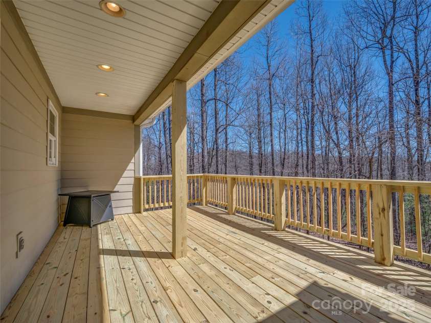 6753 Pinnacle Mountain Road, Zirconia, NC 28790.  MLS# CAR4237345, YatesRealty ID 7098. Back of house on the deck