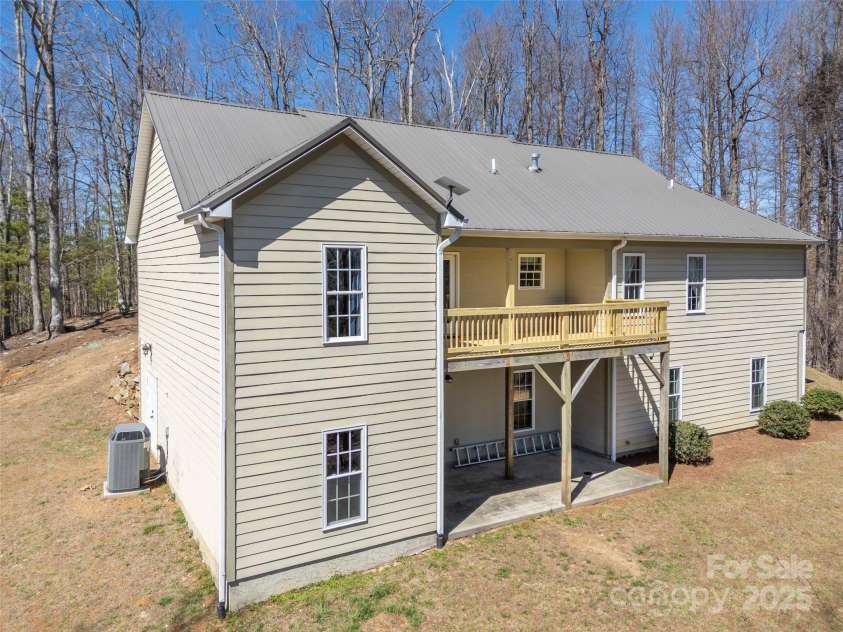 6753 Pinnacle Mountain Road, Zirconia, NC 28790.  MLS# CAR4237345, YatesRealty ID 7098. Back view of the home