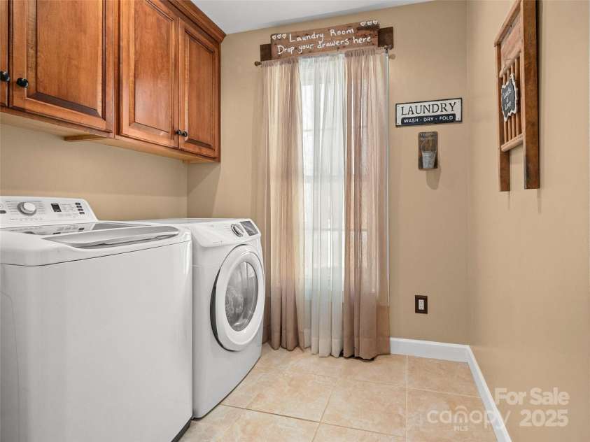 6753 Pinnacle Mountain Road, Zirconia, NC 28790.  MLS# CAR4237345, YatesRealty ID 7098. Laundry Room
