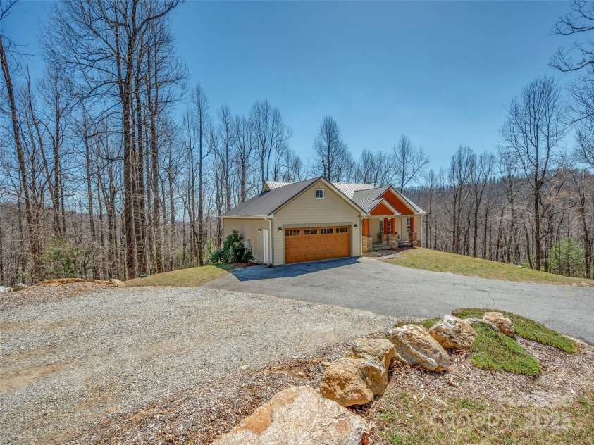 6753 Pinnacle Mountain Road, Zirconia, NC 28790.  MLS# CAR4237345, YatesRealty ID 7098. Left side of house