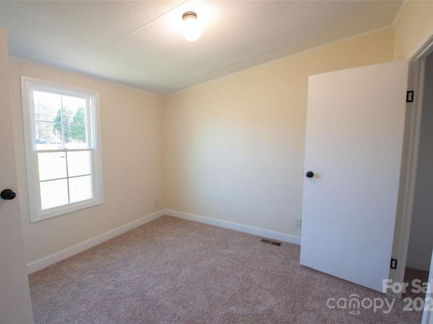 816 Perry Road, Troutman, NC 28166.  MLS# CAR4210141, YatesRealty ID 710. Another view of bedroom joining J&J ba