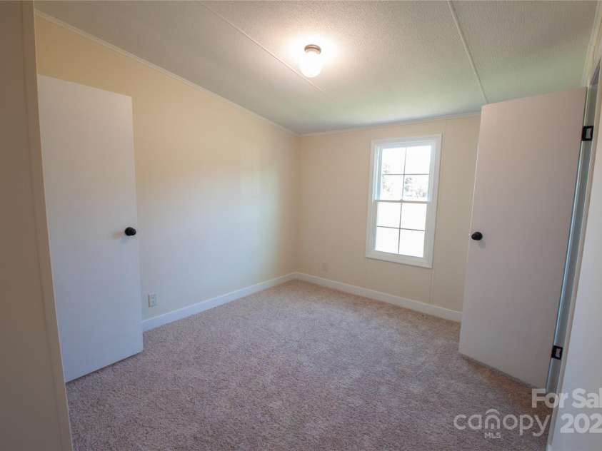 816 Perry Road, Troutman, NC 28166.  MLS# CAR4210141, YatesRealty ID 710. Bedroom joined by Jack & Jill bath