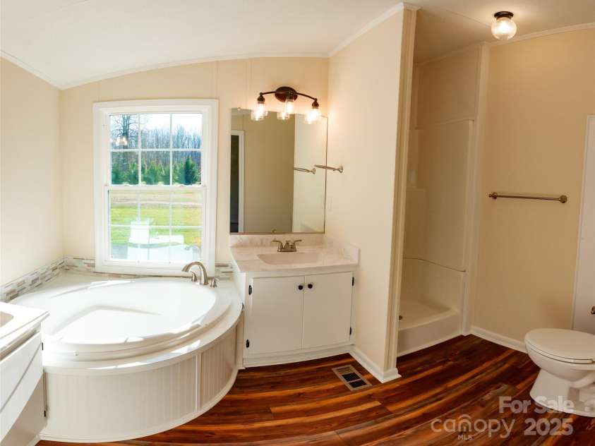 816 Perry Road, Troutman, NC 28166.  MLS# CAR4210141, YatesRealty ID 710. Primary Bath