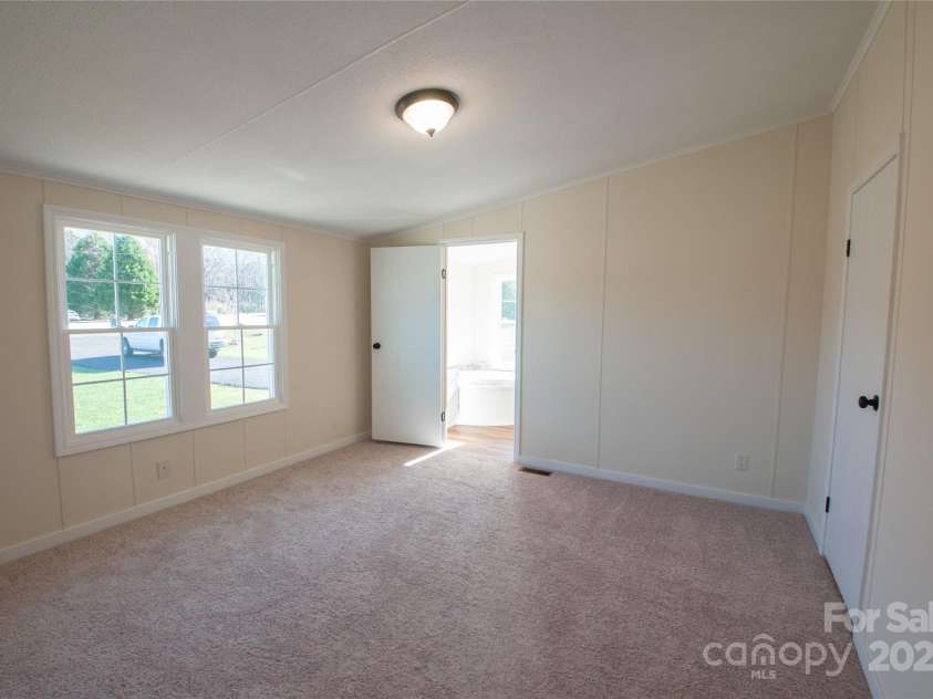 816 Perry Road, Troutman, NC 28166.  MLS# CAR4210141, YatesRealty ID 710. Primary Bedroom