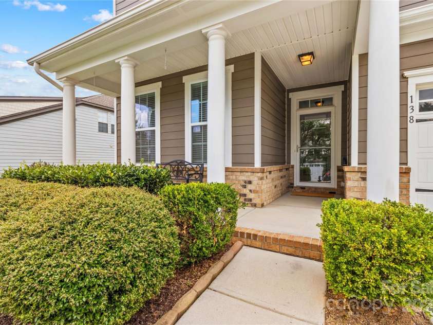 138 Byers Commons Drive, Mooresville, NC 28117.  MLS# CAR4218402, YatesRealty ID 7107. Full Front Porch