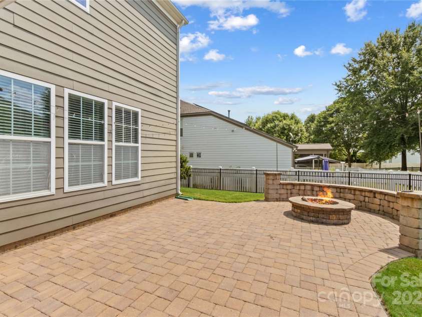 138 Byers Commons Drive, Mooresville, NC 28117.  MLS# CAR4326214, YatesRealty ID 7107. Backyard features custom Patio; Firepit