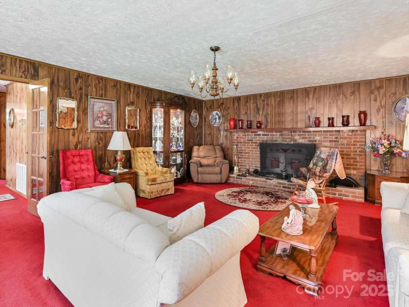 7530 NC 208 Highway, Marshall, NC 28753.  MLS# CAR4241127, YatesRealty ID 7109. Den w/ Wood Insert in the fireplace.