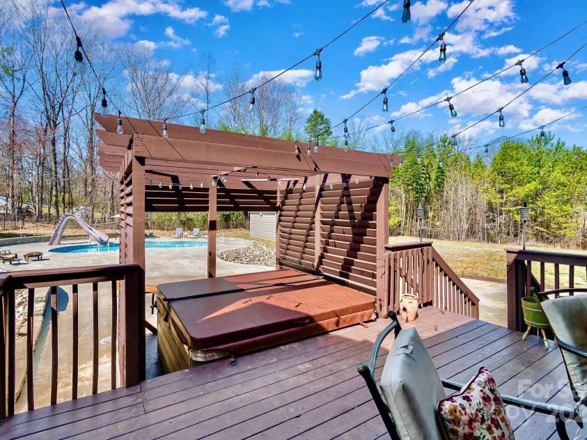 3827 Tarmac Drive, Sophia, NC 27350.  MLS# CAR4231508, YatesRealty ID 7110. Hot Tub w/ Fireplace