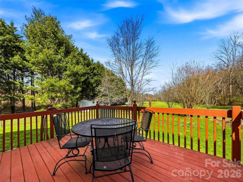 61 Rolling Hills Road, Mills River, NC 28759.  MLS# CAR4355749, YatesRealty ID 7110. Back deck overlooking yard