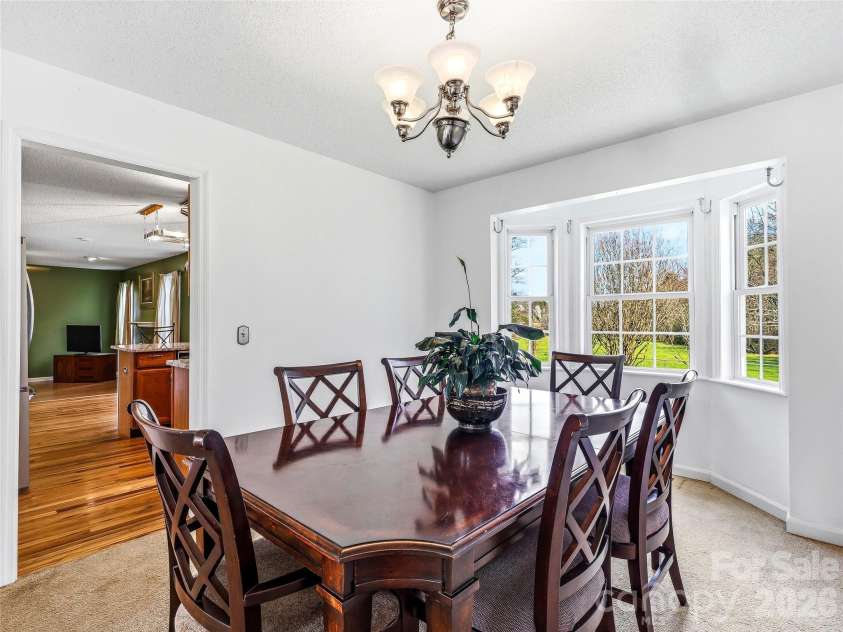61 Rolling Hills Road, Mills River, NC 28759.  MLS# CAR4355749, YatesRealty ID 7110. Dining Room flows from living room into kitchen