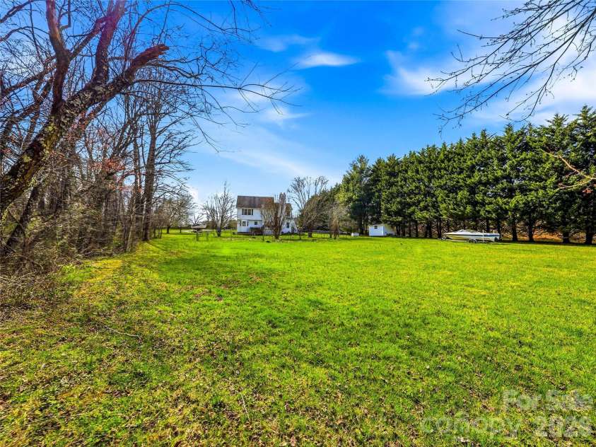 61 Rolling Hills Road, Mills River, NC 28759.  MLS# CAR4355749, YatesRealty ID 7110. Flat usable land for gardening, recreation or pets!