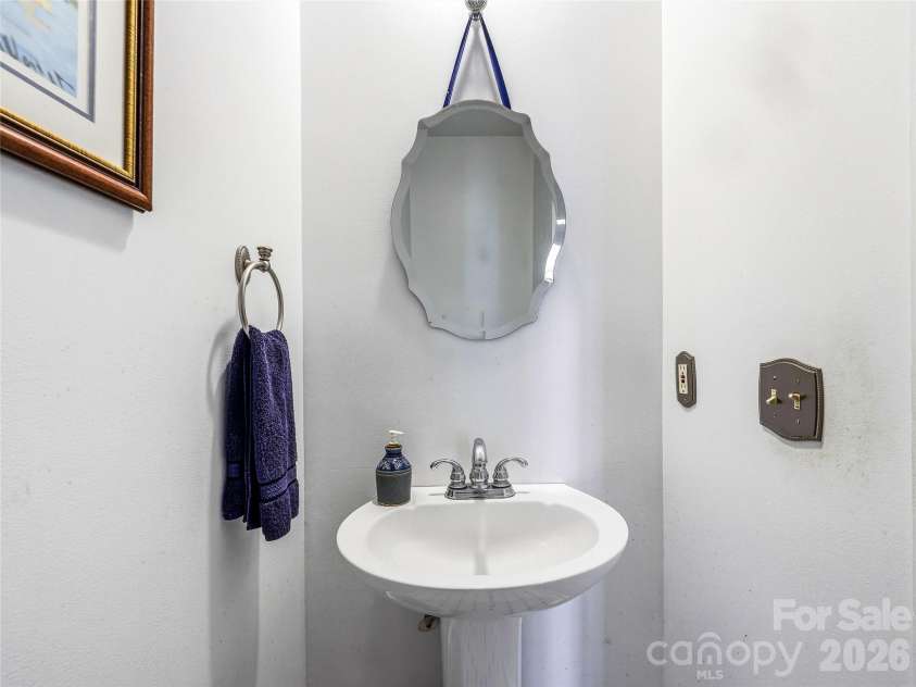 61 Rolling Hills Road, Mills River, NC 28759.  MLS# CAR4355749, YatesRealty ID 7110. Powder room on main level