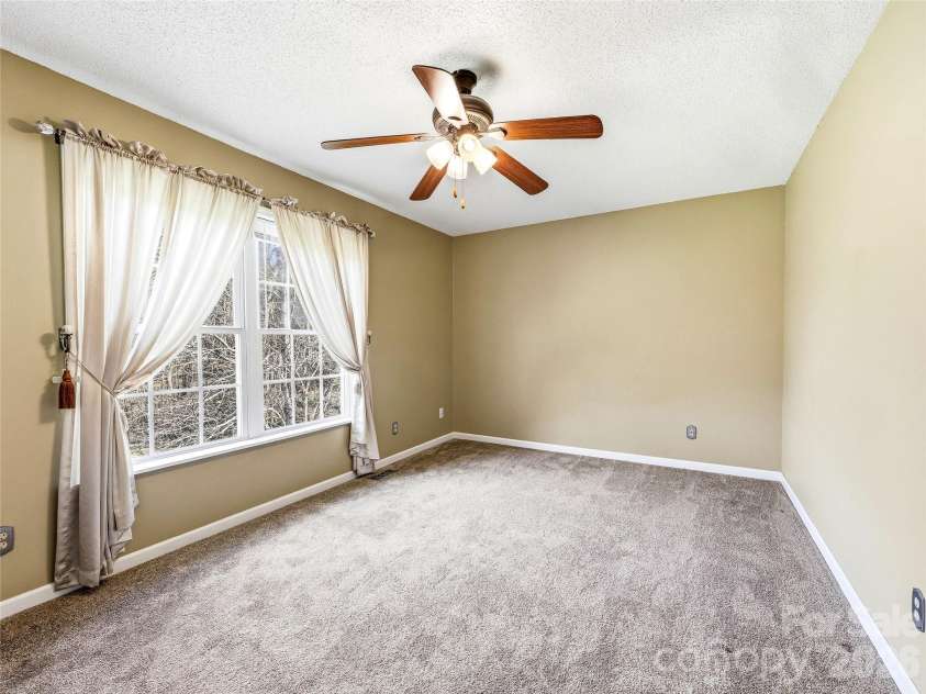 61 Rolling Hills Road, Mills River, NC 28759.  MLS# CAR4355749, YatesRealty ID 7110. Upper level bedroom