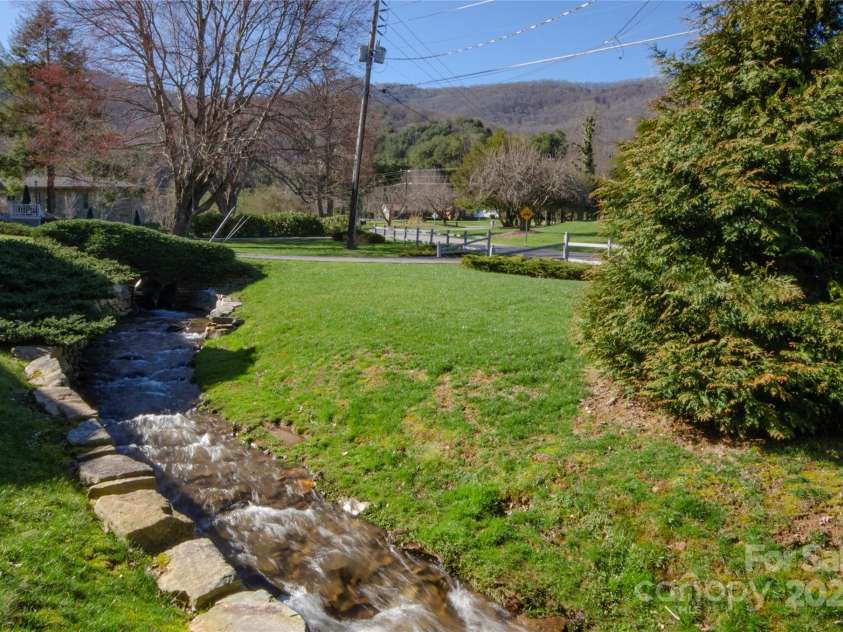 549 Eagles Nest Road, Waynesville, NC 28786.  MLS# CAR4243977, YatesRealty ID 7112. Creek front