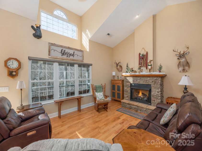 220 George Sutton Road, Waynesville, NC 28785.  MLS# CAR4330398, YatesRealty ID 712. Fire shown is for promotional purposes only.