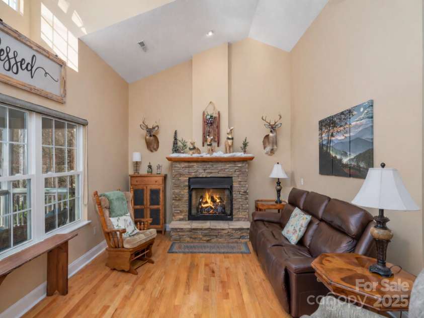 220 George Sutton Road, Waynesville, NC 28785.  MLS# CAR4330398, YatesRealty ID 712. Fire shown is for promotional purposes only.