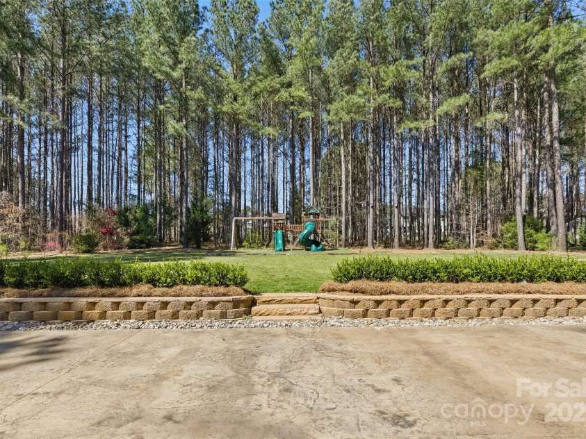 160 Belfry Loop, Mooresville, NC 28117.  MLS# CAR4235461, YatesRealty ID 7120. Backyard Wooded View