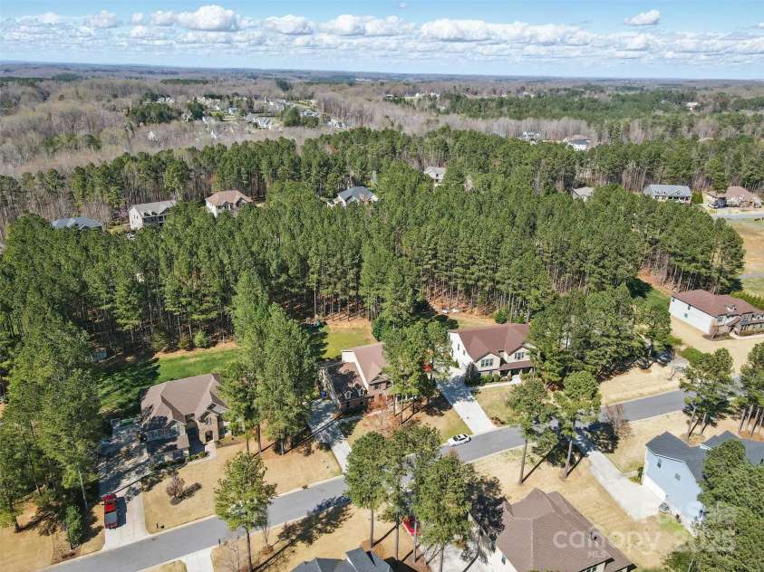 160 Belfry Loop, Mooresville, NC 28117.  MLS# CAR4235461, YatesRealty ID 7120. View of woods around home