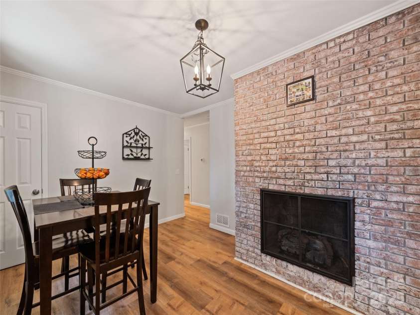 263 Blanton Street, Columbus, NC 28722.  MLS# CAR4190973, YatesRealty ID 7130. Dining Room With Fireplace
