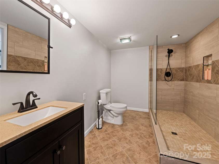 263 Blanton Street, Columbus, NC 28722.  MLS# CAR4190973, YatesRealty ID 7130. Downstairs Bathroom
