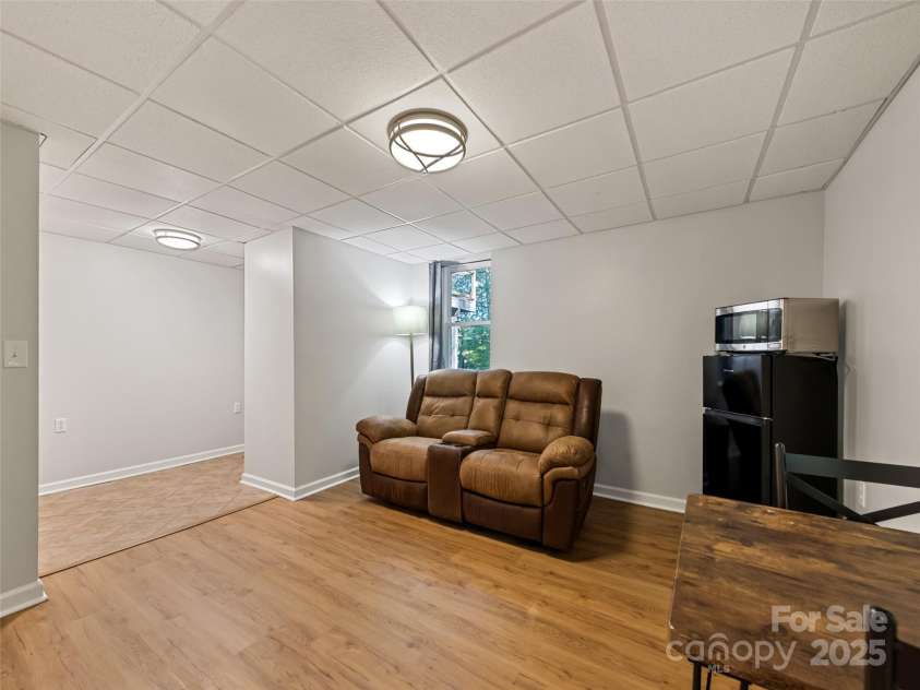 263 Blanton Street, Columbus, NC 28722.  MLS# CAR4190973, YatesRealty ID 7130. Downstairs Dining Living Combo