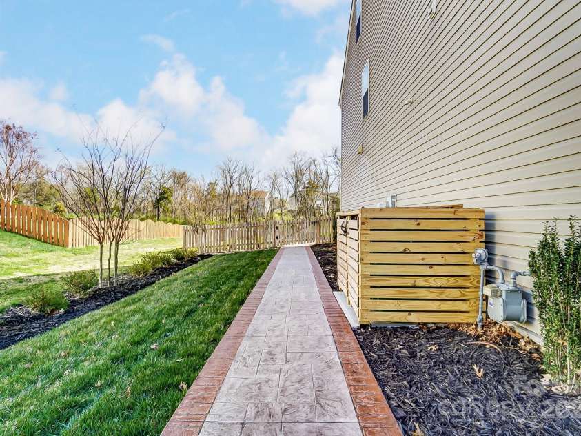 10321 Solar Way, Charlotte, NC 28278.  MLS# CAR4234533, YatesRealty ID 7133. Sidewalk that leads from the front to the back of the home