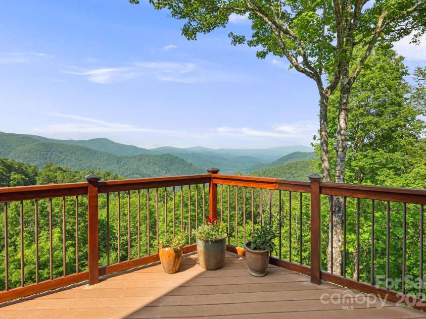 197 Cherry Knob Drive, Mars Hill, NC 28754.  MLS# CAR4271284, YatesRealty ID 7144. Breathtaking, layered mountain views from the full-length deck—an ever-changing backdrop for morning coffee or sunset relaxation.