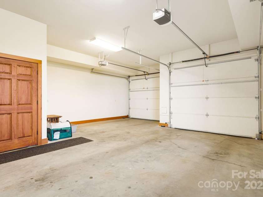 197 Cherry Knob Drive, Mars Hill, NC 28754.  MLS# CAR4271284, YatesRealty ID 7144. Spacious two-car garage with automatic doors and interior access for secure and convenient entry to the lower level or elevator