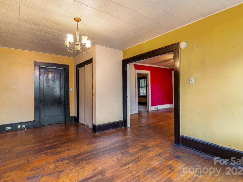 96 French Broad Avenue, Asheville, NC 28801.  MLS# CAR4205683, YatesRealty ID 715. Linen closet in dining room
