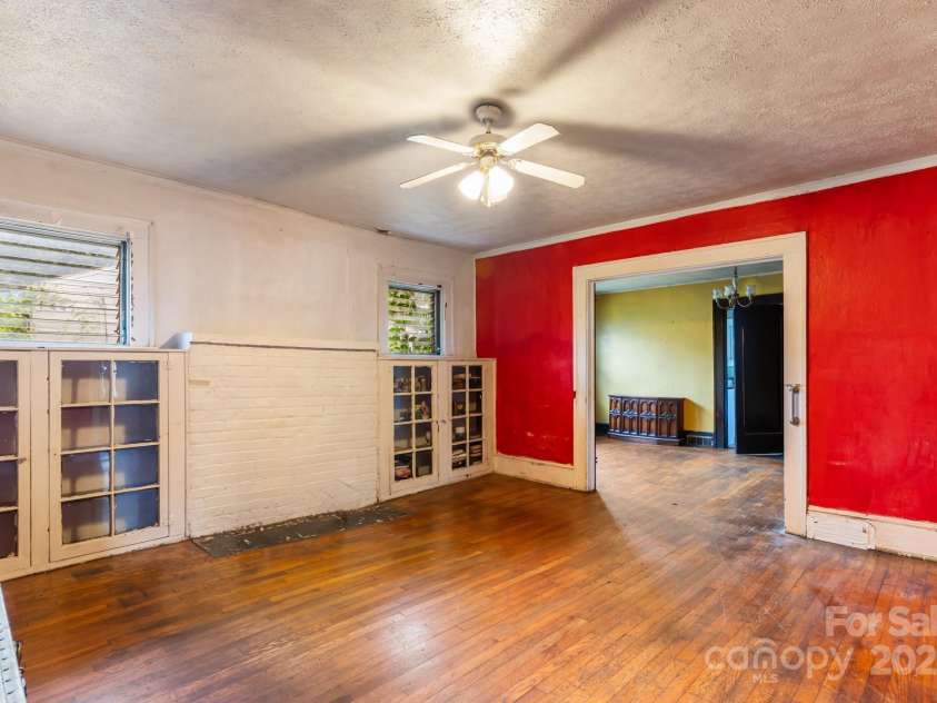 96 French Broad Avenue, Asheville, NC 28801.  MLS# CAR4205683, YatesRealty ID 715. Living room with built ins