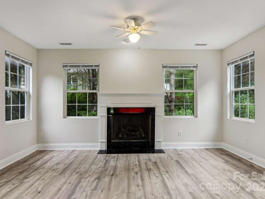 10 Grove End Road, Fletcher, NC 28732.  MLS# CAR4285704, YatesRealty ID 7150. Relax by the fire in the sunroom