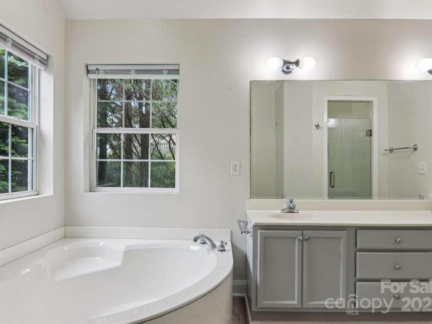 10 Grove End Road, Fletcher, NC 28732.  MLS# CAR4285704, YatesRealty ID 7150. Relax in your primary bathroom