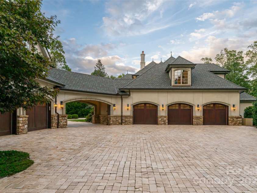 316 Braeside Court, Asheville, NC 28803.  MLS# CAR4198099, YatesRealty ID 7157. Attached 3 car garage and detached 2 car garage provide space for the car enthusiast or simply for additional storage. 380 sf of finished space above the 2 car garage would be a great studio or gym 