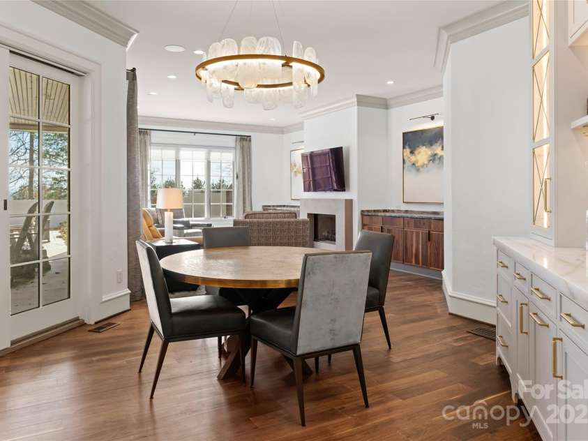 316 Braeside Court, Asheville, NC 28803.  MLS# CAR4198099, YatesRealty ID 7157. The kitchen seamlessly flows into the dining area and the keeping room as well as the covered outdoor patio