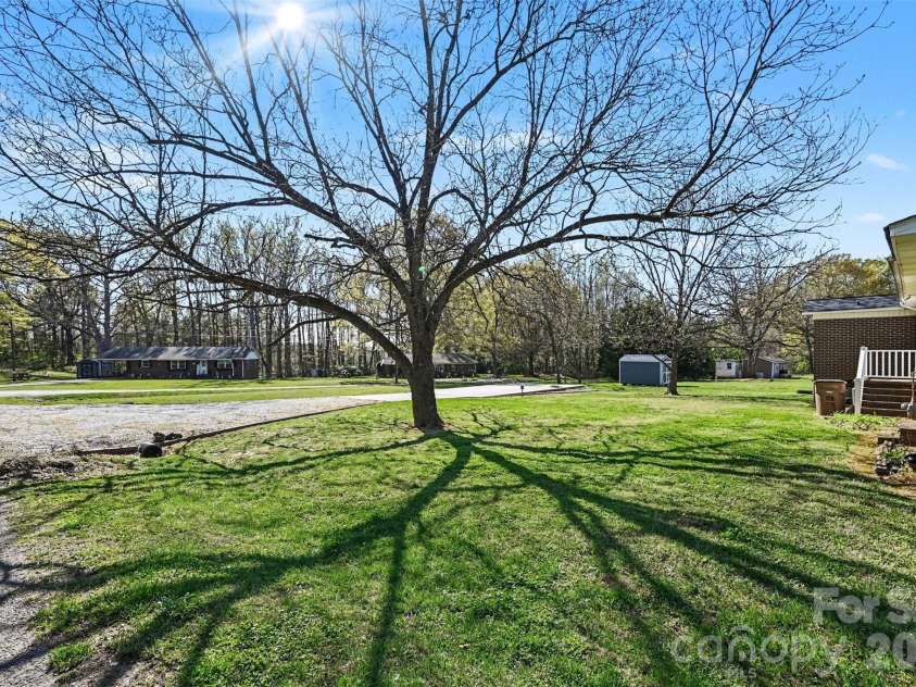 2008 Kings Road, Shelby, NC 28150.  MLS# CAR4359101, YatesRealty ID 7159. Beautiful tree in back yard