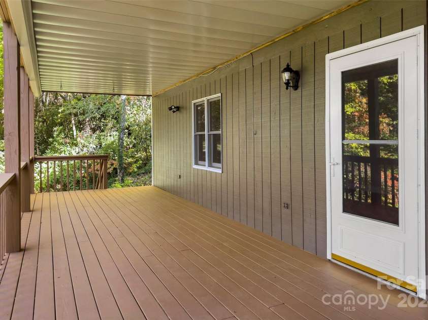 8 Tree Top Place, Black Mountain, NC 28711.  MLS# CAR4193609, YatesRealty ID 7161. Basement level deck