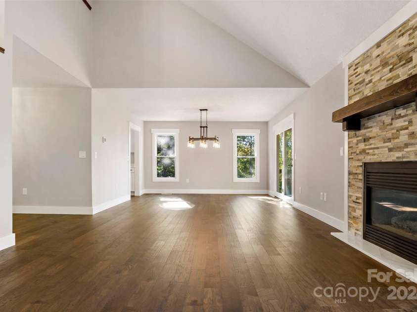 8 Tree Top Place, Black Mountain, NC 28711.  MLS# CAR4193609, YatesRealty ID 7161. Living room into dining area